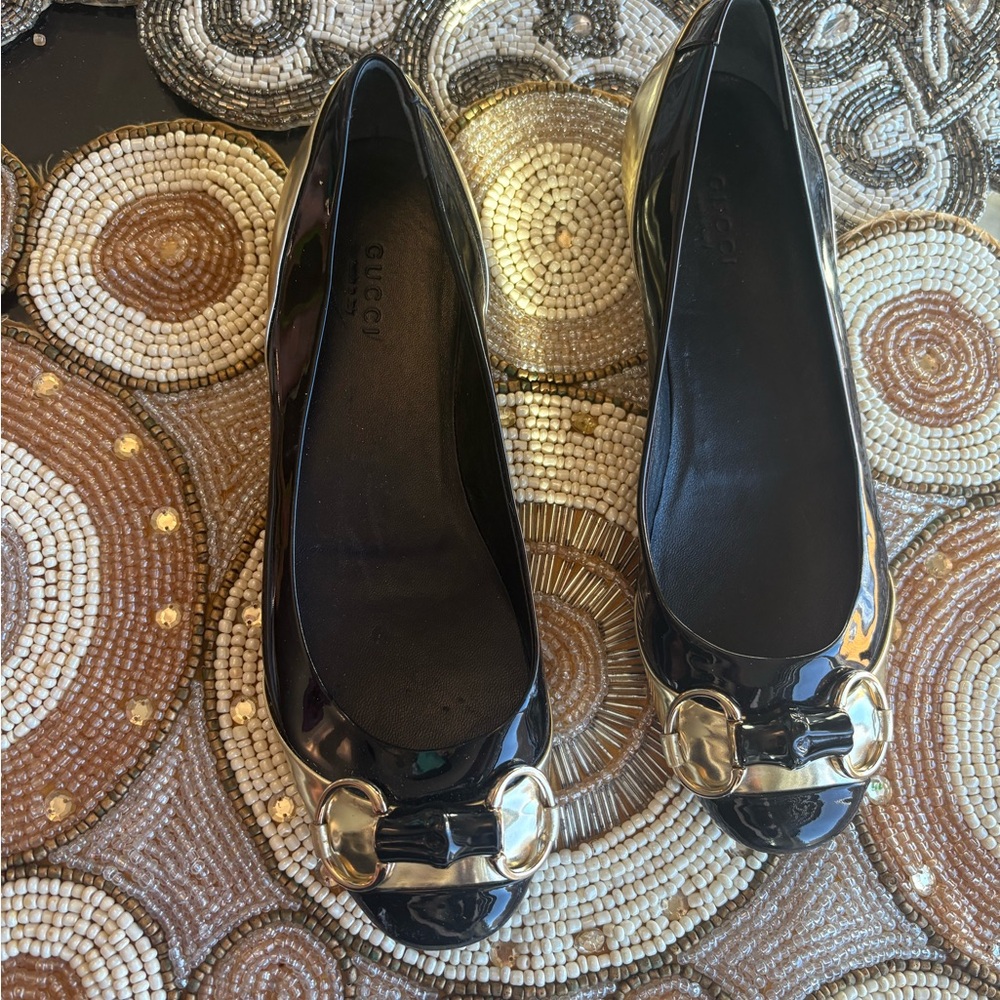 Gucci Women's Black Flats with Gold Detailing